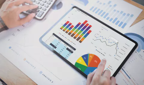 businesswomanusingtabletanalysisgraphcompanyfinancI1693